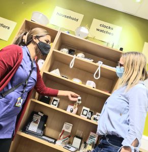 One of our Beacon Volunteers helping a service user browse