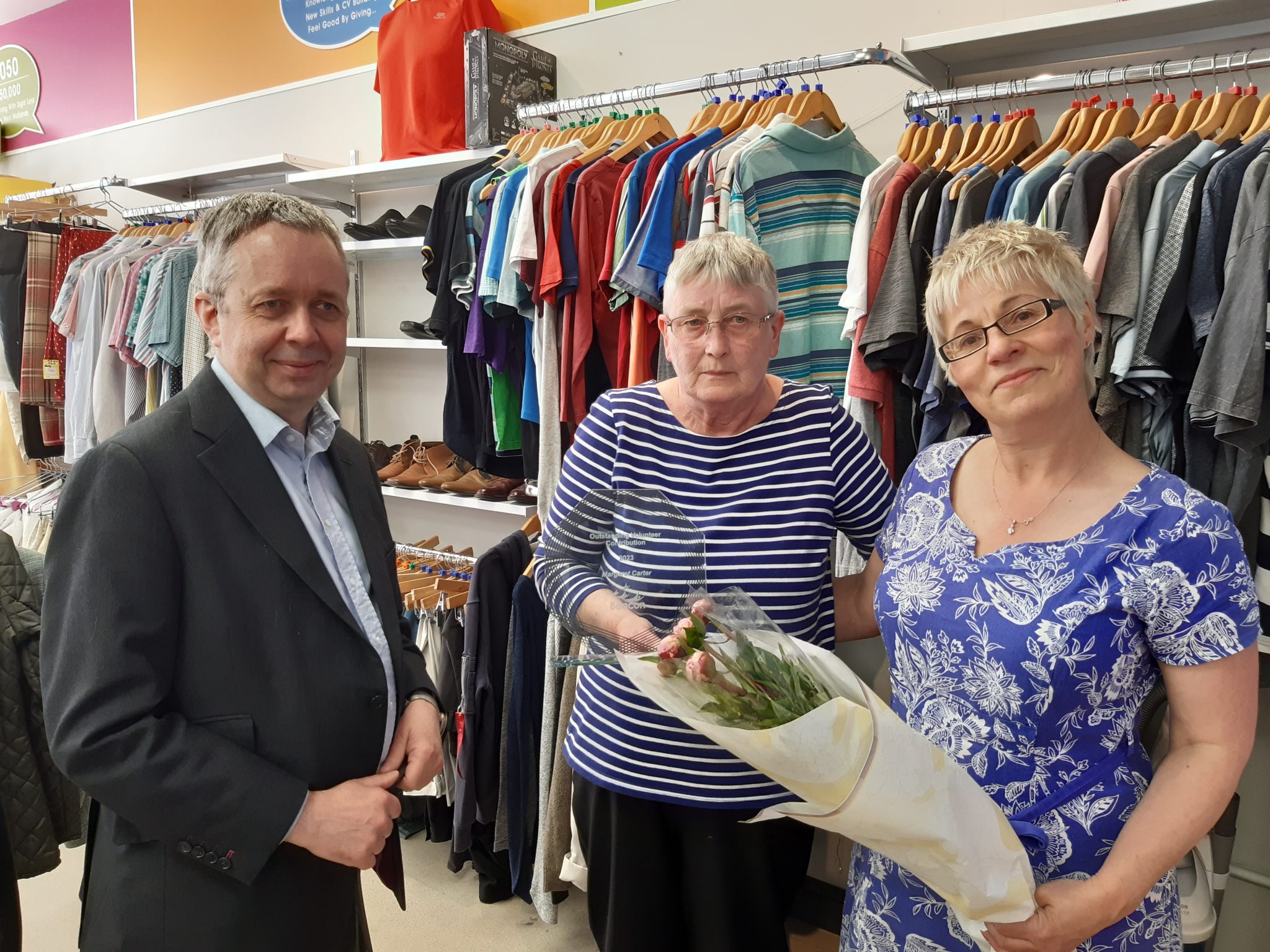 This shows our Corporate Services Director Philip Mills on the left, Nicola Bench, Halesowen assistant shop manager on the right and Margaret, with her award in the middle.